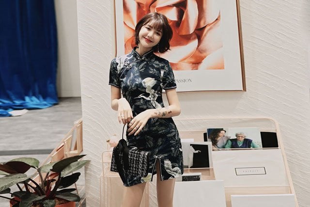 Chinese girl wear a modern print qipao